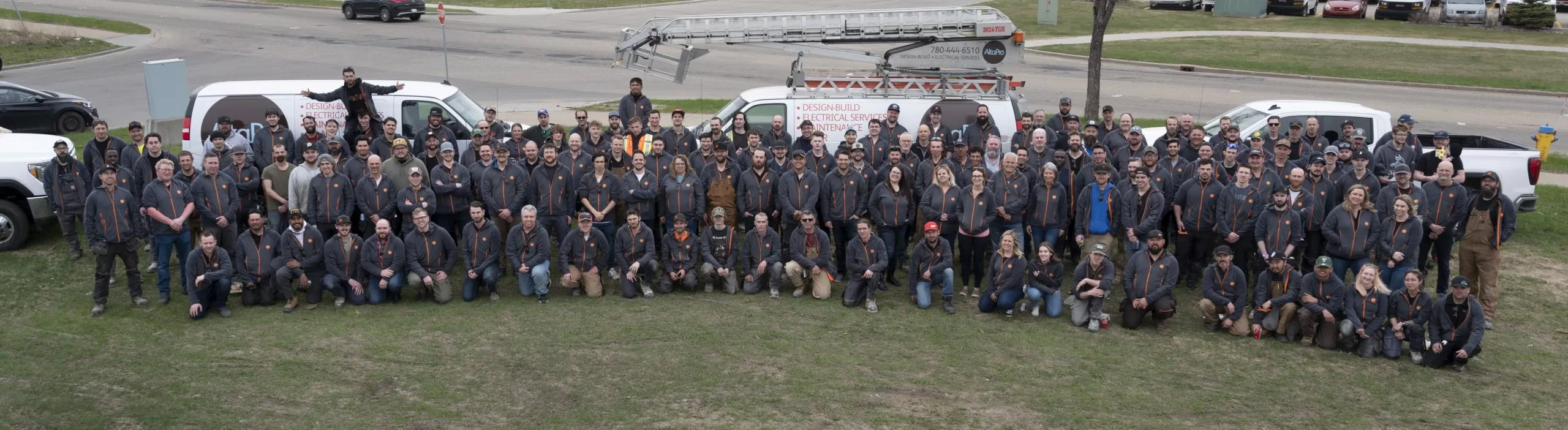 AltaPro Team Photo in 2022 with AltaPro trucks and service vehicles in Background